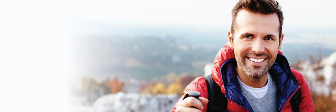 man smiling in red jacket | Dentist Vallejo CA