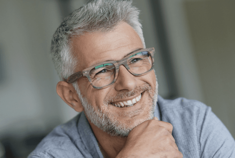 smiling man wearing glasses