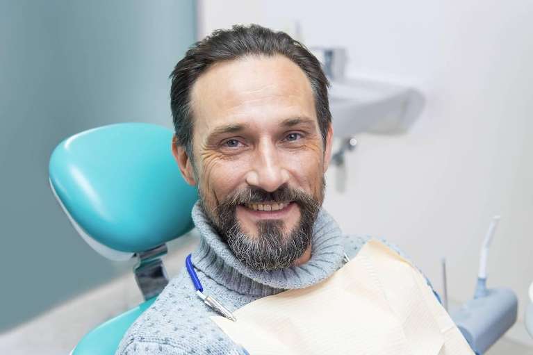 man sitting in a dental chair