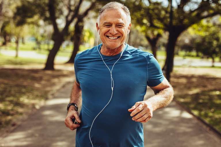 man jogging while listening to music