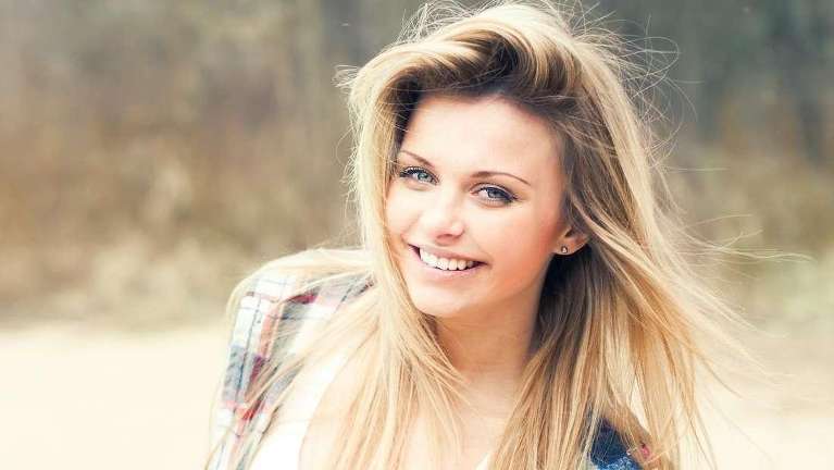 woman with blonde hair smiling