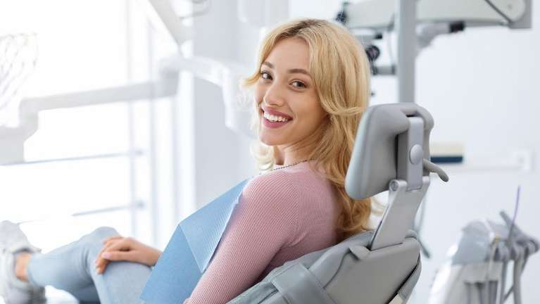 woman sitting in a dental chair