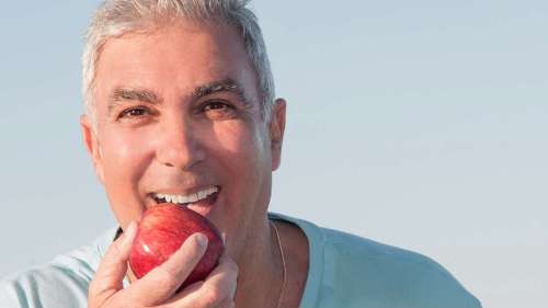 man eating apple