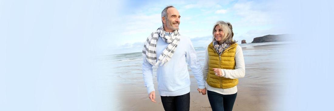 Man and Woman holding hands walking on beach | Dentist Vallejo CA