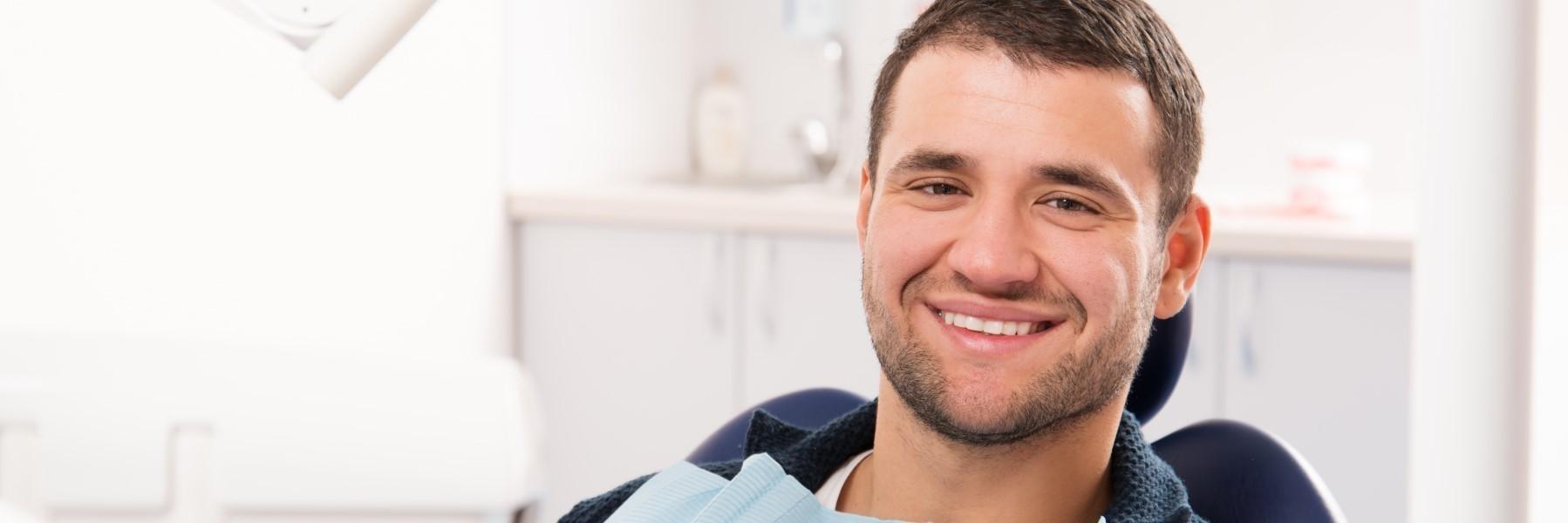 Man in dental chair smiling